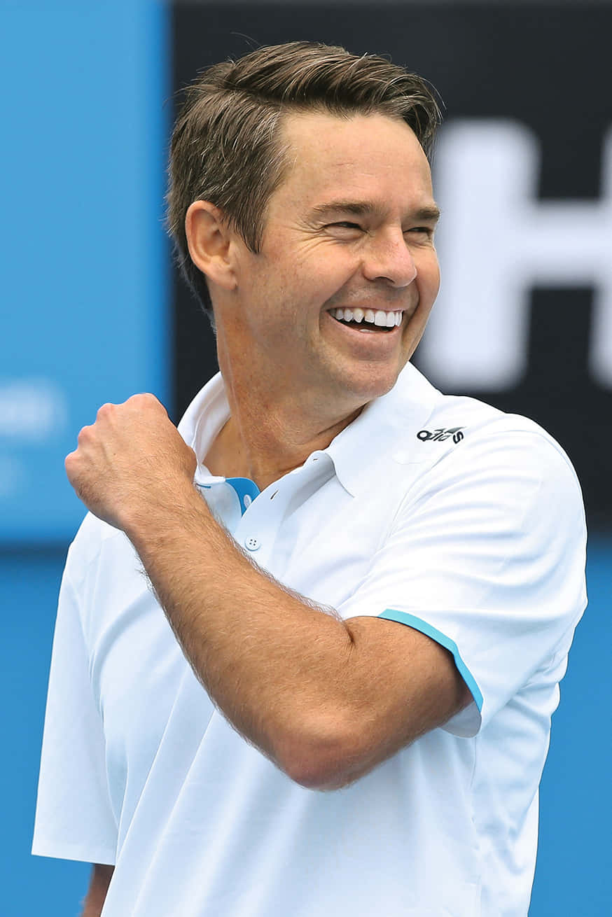 Todd Woodbridge - Triumph And Joy On The Tennis Court Wallpaper