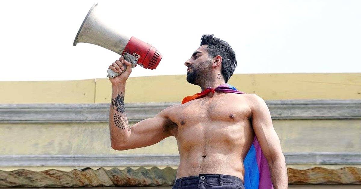 Topless Ayushmann Khurrana Holding A Megaphone Wallpaper