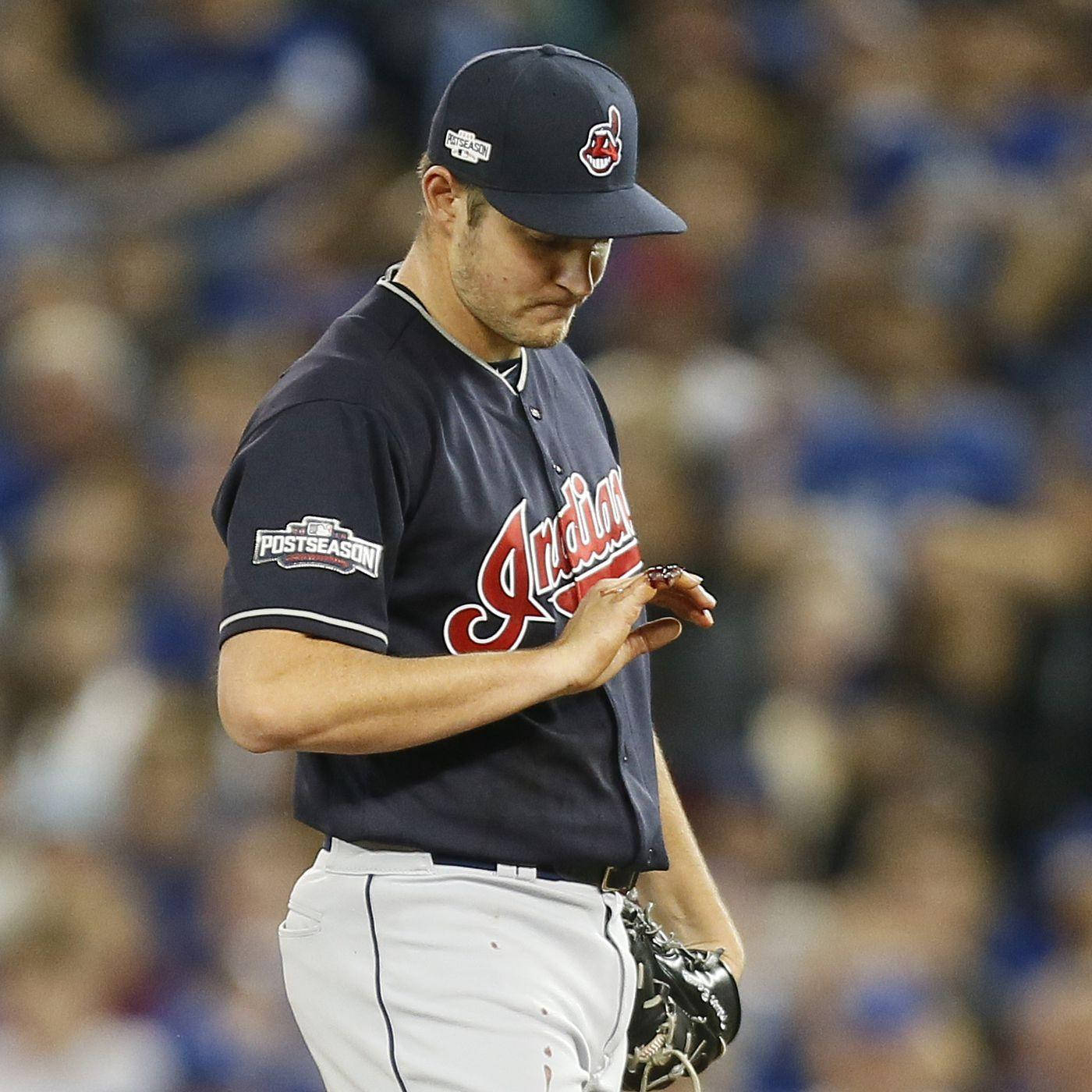 Trevor Bauer Looking At His Rings Wallpaper