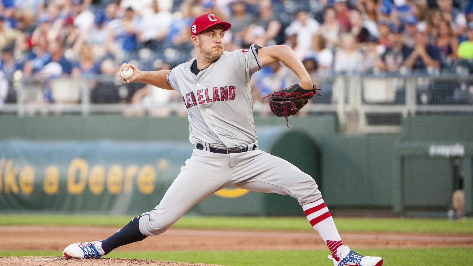 Trevor Bauer Throwing Baseball In Front Of Crowd Wallpaper