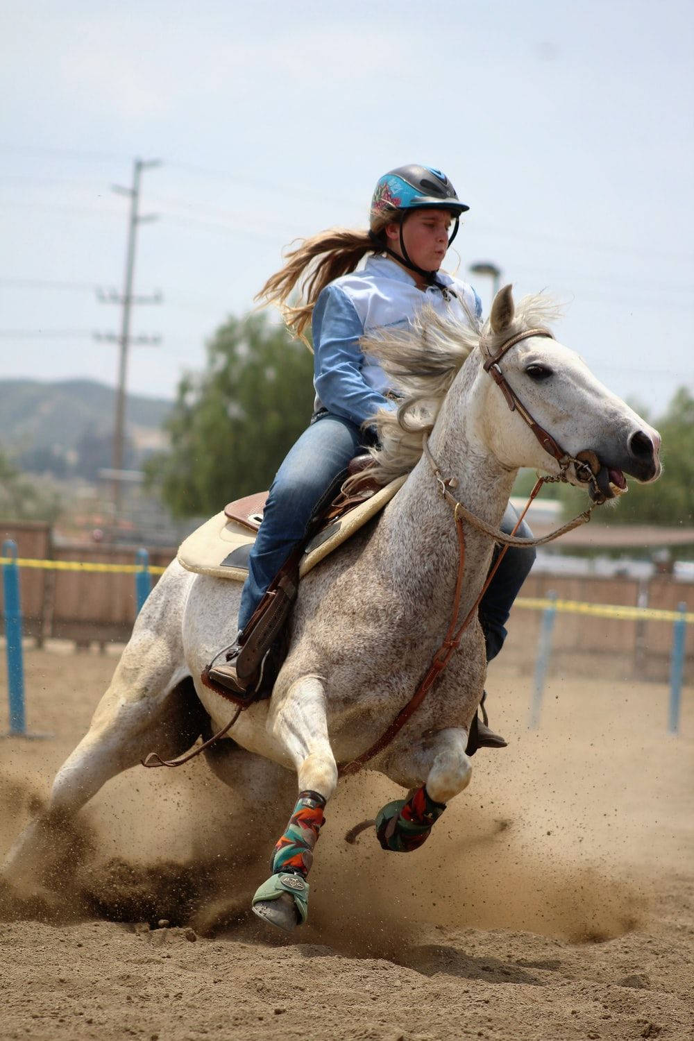 Two Barrel Racers Showing Their Skills At A Rodeo Wallpaper