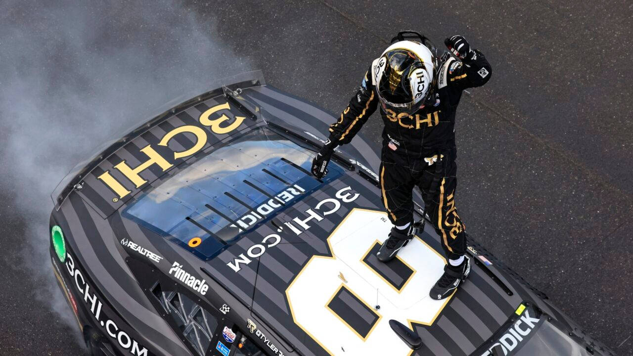 Tyler Reddick On Top Of Car Wallpaper