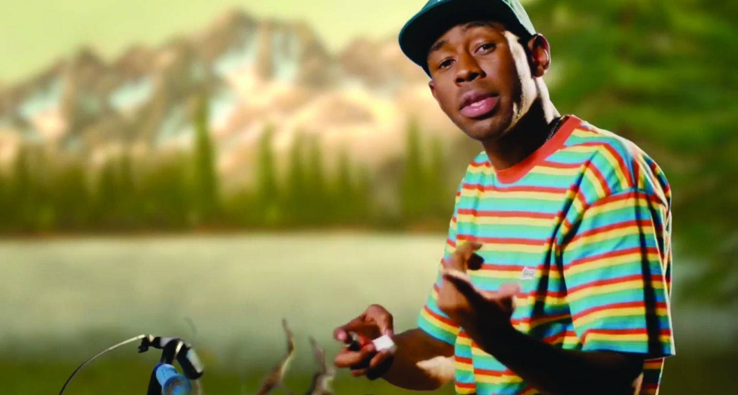 Tyler The Creator Wearing A Striped Shirt Wallpaper