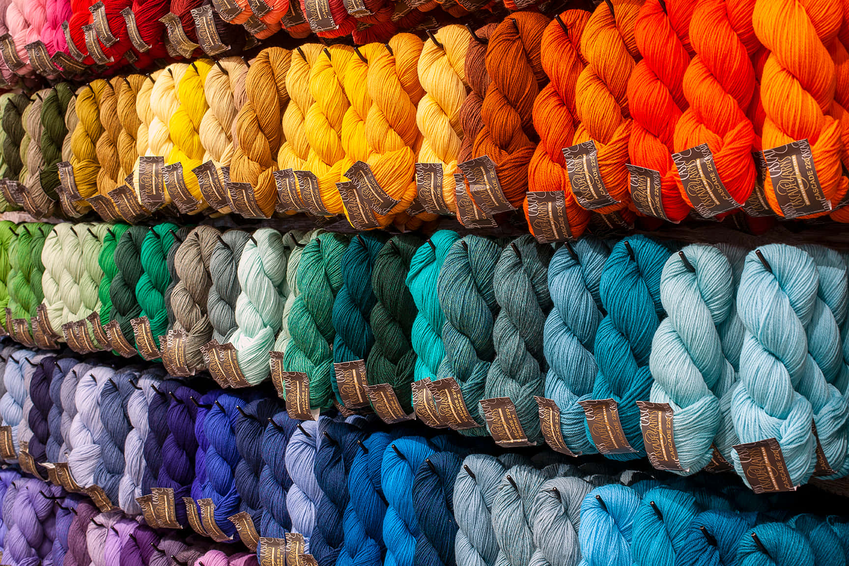 Vibrant Colors Of Knitting Yarns Wallpaper