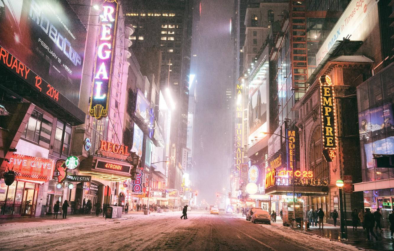 Vibrant Energy Of Times Square At Night Wallpaper