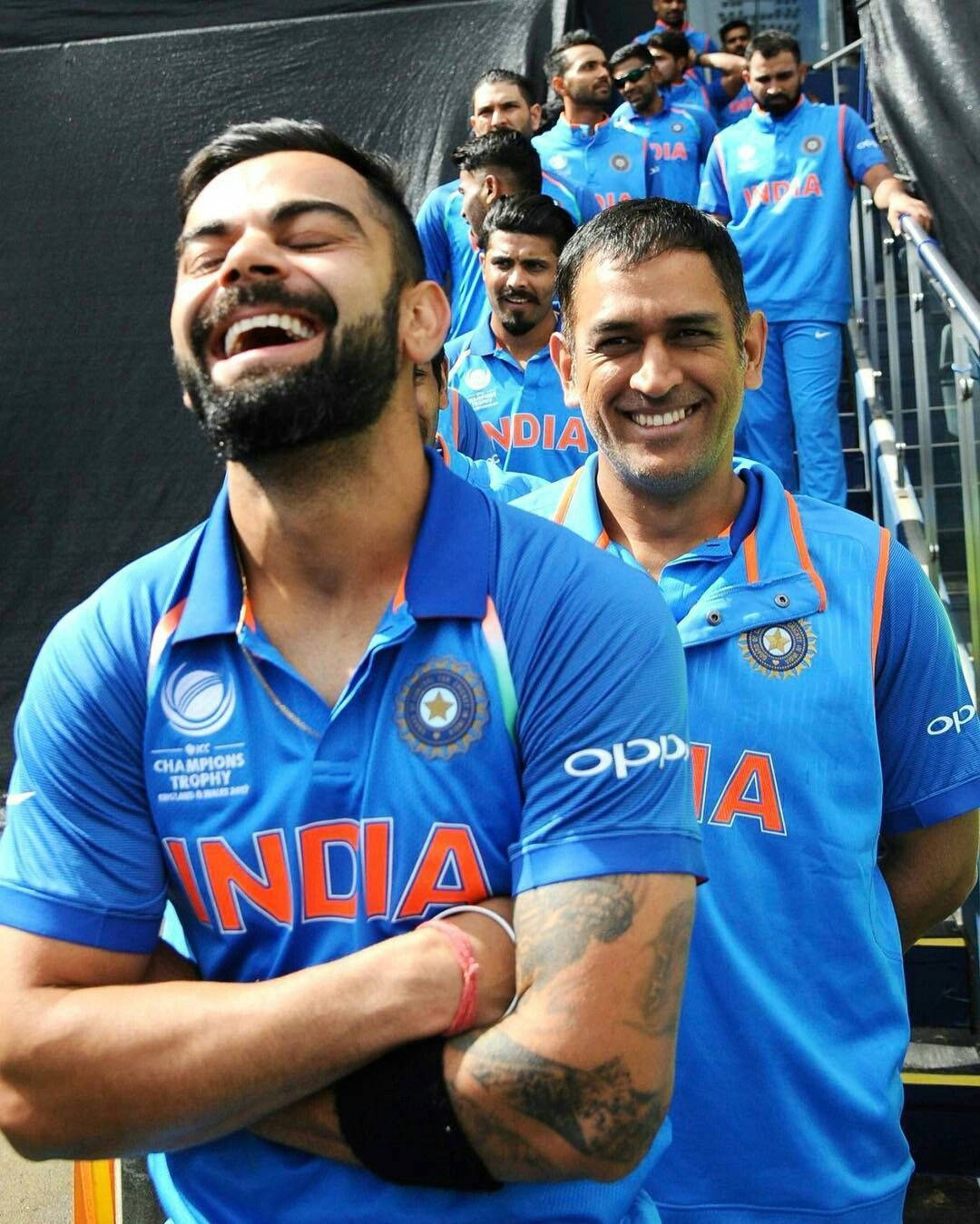 Virat_ Kohli_and_ M S_ Dhoni_ Laughing Wallpaper