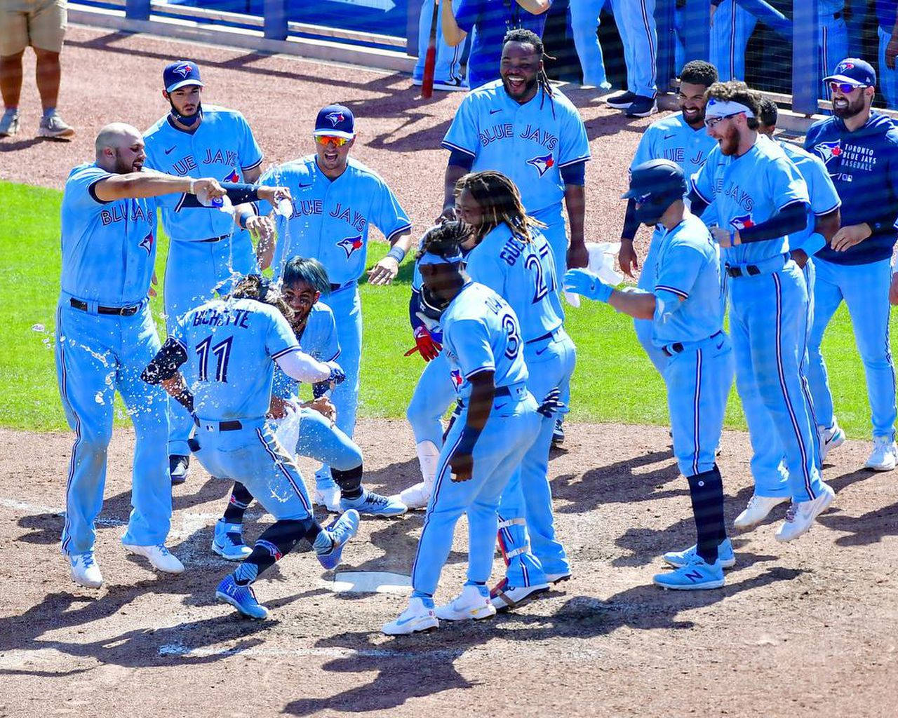 Vladimir Guerrero Jr Celebrating With Team Wallpaper