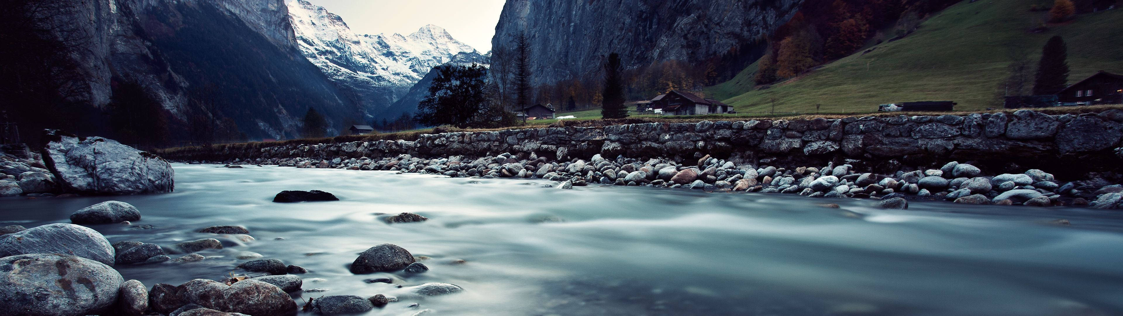 Wandering River Wrapping Its Way Through A Forest Wallpaper