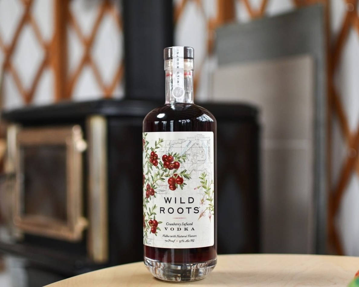 Wild Roots Huckleberry Vodka Purple Bottle Wallpaper