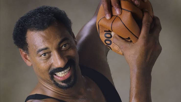 Wilt Chamberlain Crushing A Ball Wallpaper