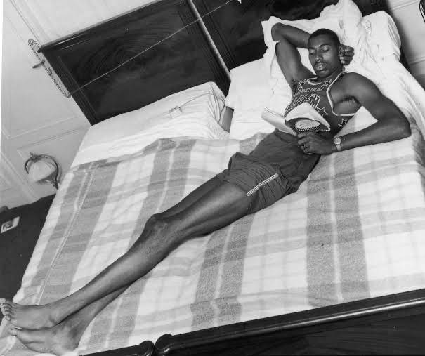 Wilt Chamberlain On Bed Wallpaper