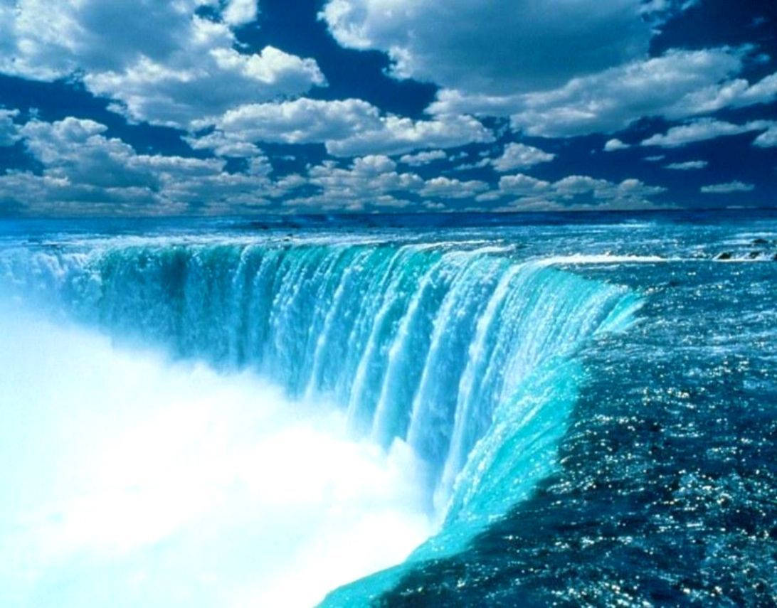 Witness The Vibrant And Powerful Beauty Of Niagara Falls Wallpaper