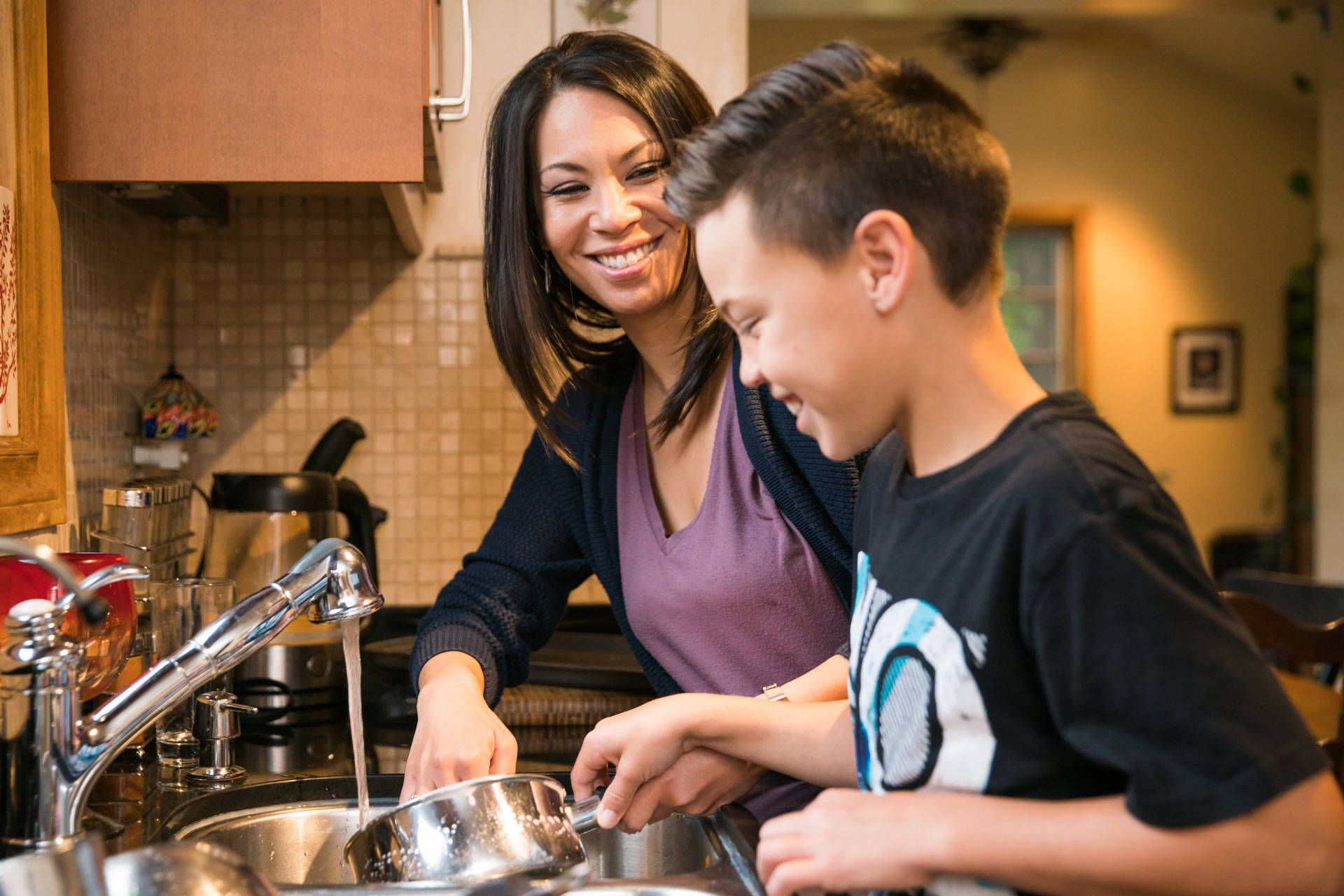 Woman And Boy House Cleaning Wallpaper