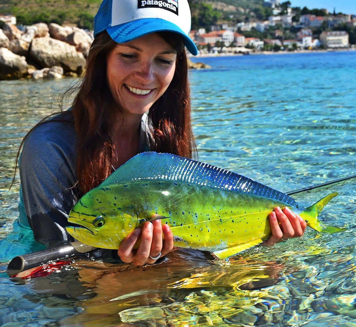 Woman Holding Mahi Mahi Catch Wallpaper