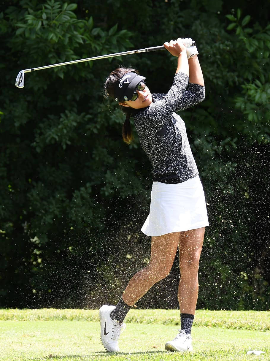 Woman Swinging A Club Golf Phone Wallpaper