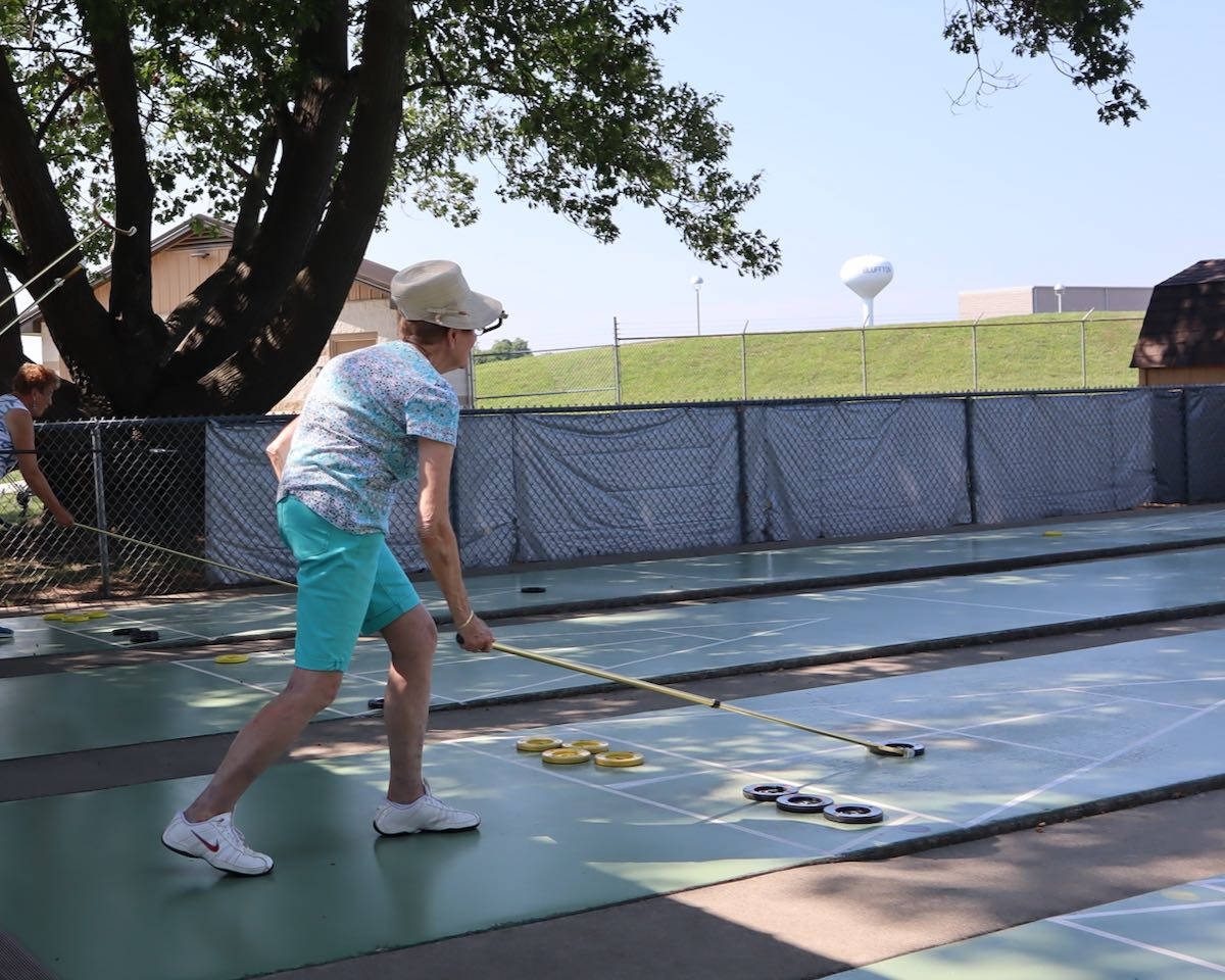 Women Playing In A Bluffton Shuffleboard Competition Wallpaper