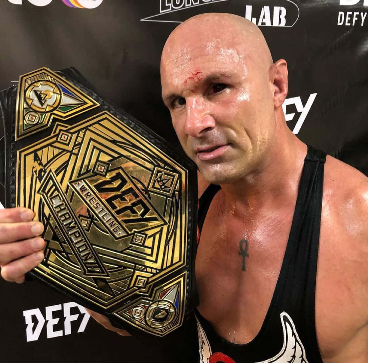 Wrestlerwith Championship Belt Wallpaper