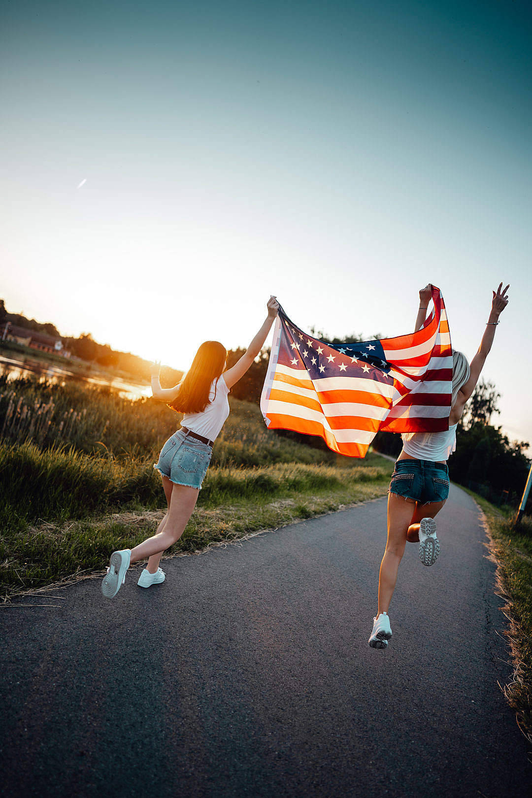 Young Girls Running For Freedom Wallpaper