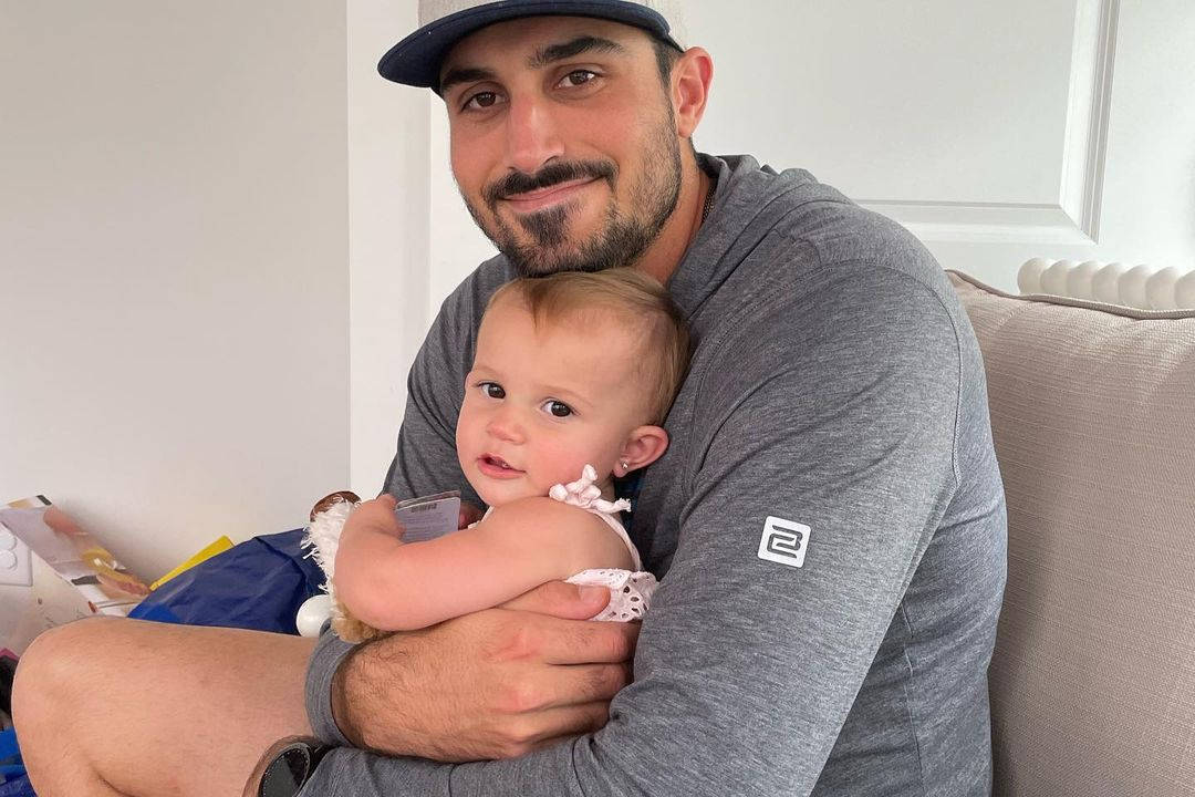 Zach Eflin Hugging His Daughter Wallpaper