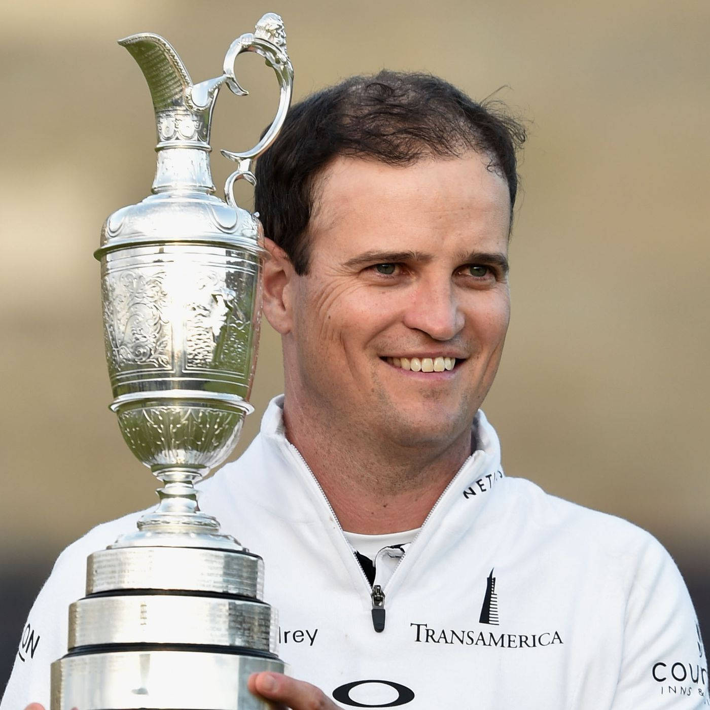 Zach Johnson Holding A Trophy Wallpaper