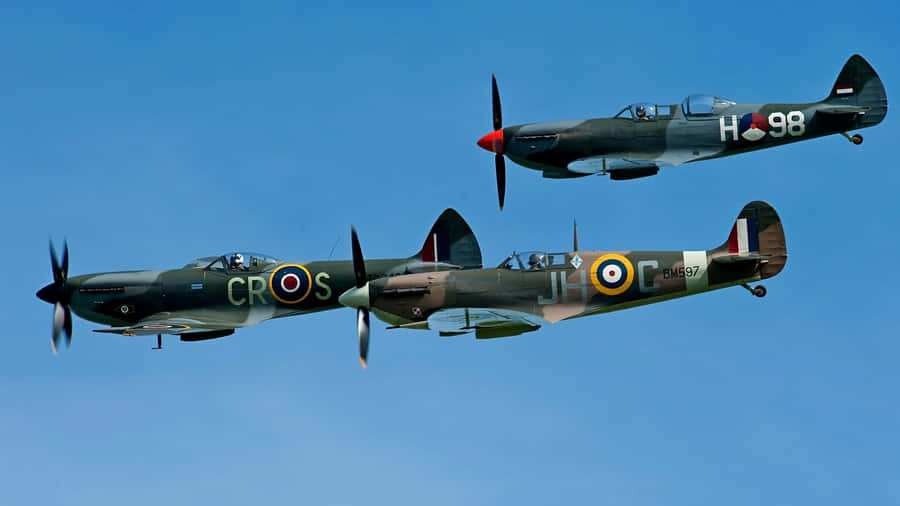 A Beautiful Spitfire Flying Through A Picturesque Sky Wallpaper