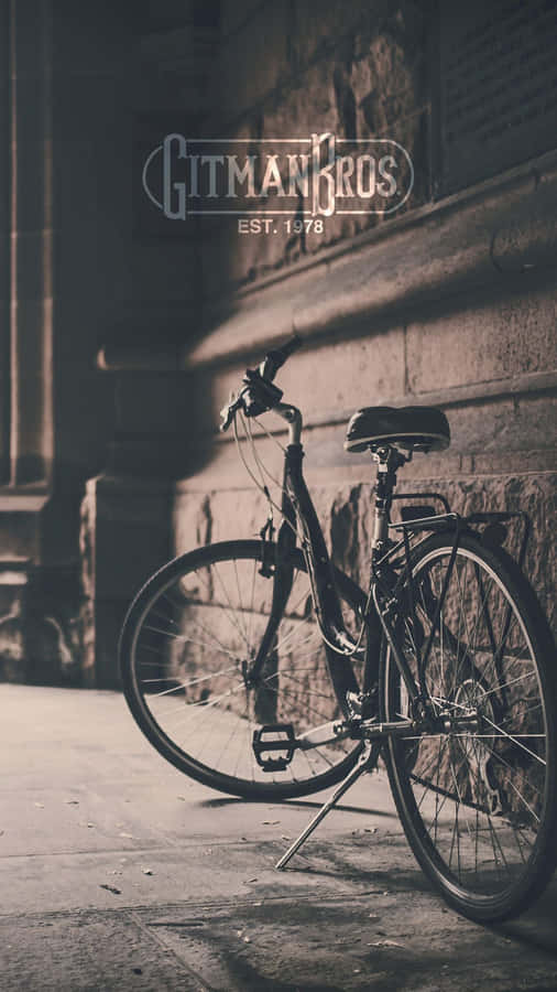 A Bike Is Leaning Against A Wall Wallpaper