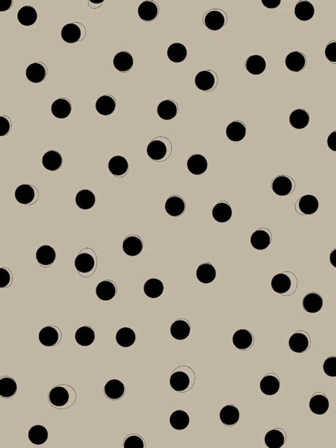 A Black And White Polka Dot Pattern On A Beige Background Wallpaper