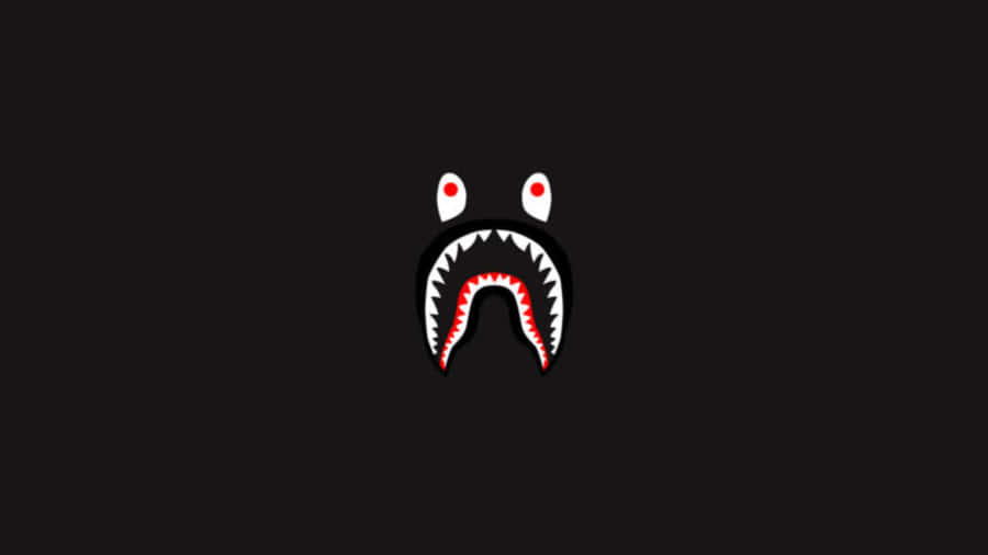 A Black Background With A Red Shark Face Wallpaper