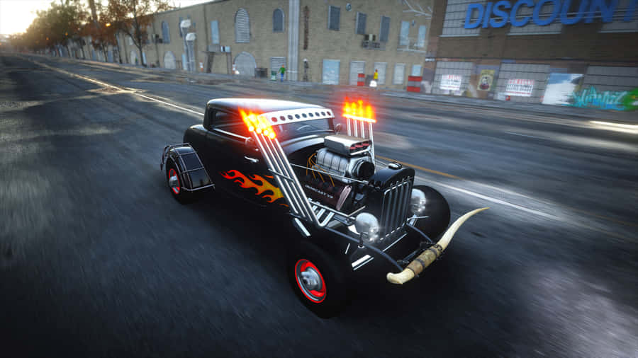 A Black Car Driving Down The Street Wallpaper