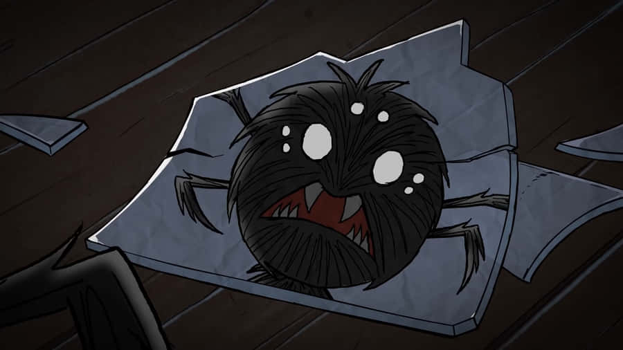 A Black Spider Is Sitting On A Piece Of Paper Wallpaper