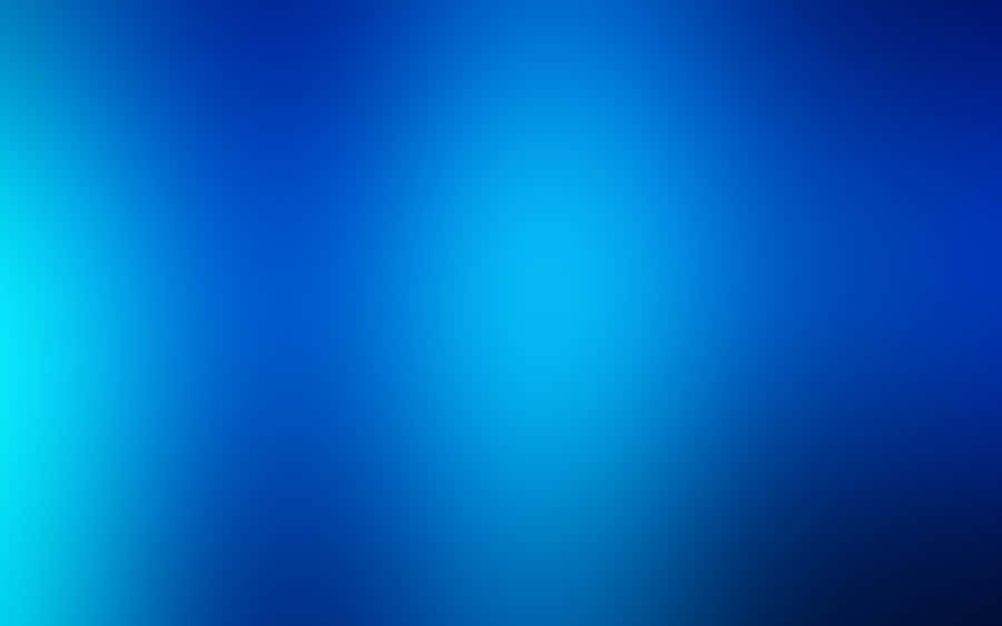 A Blue Desktop Illuminated With Natural Light Wallpaper