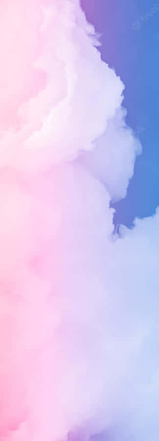 A Captivating Landscape Of Pink And Blue Clouds In The Sky. Wallpaper