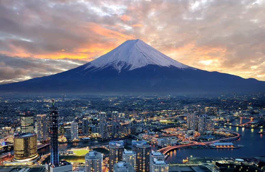 A City And Mountain At Dusk Wallpaper
