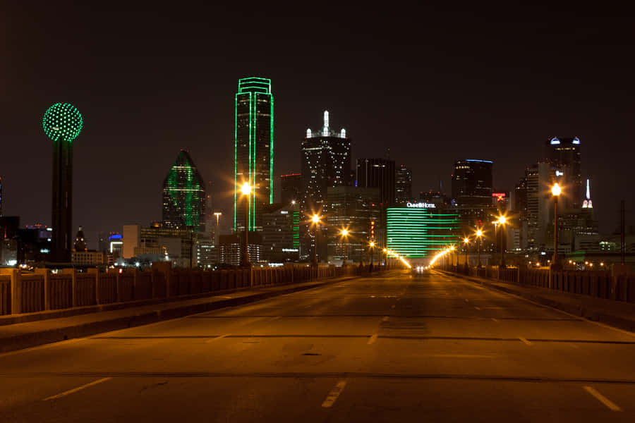 A City Skyline At Night Wallpaper