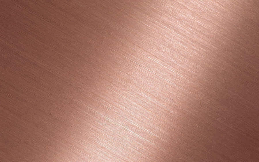 A Close Up Of A Copper Textured Surface Wallpaper