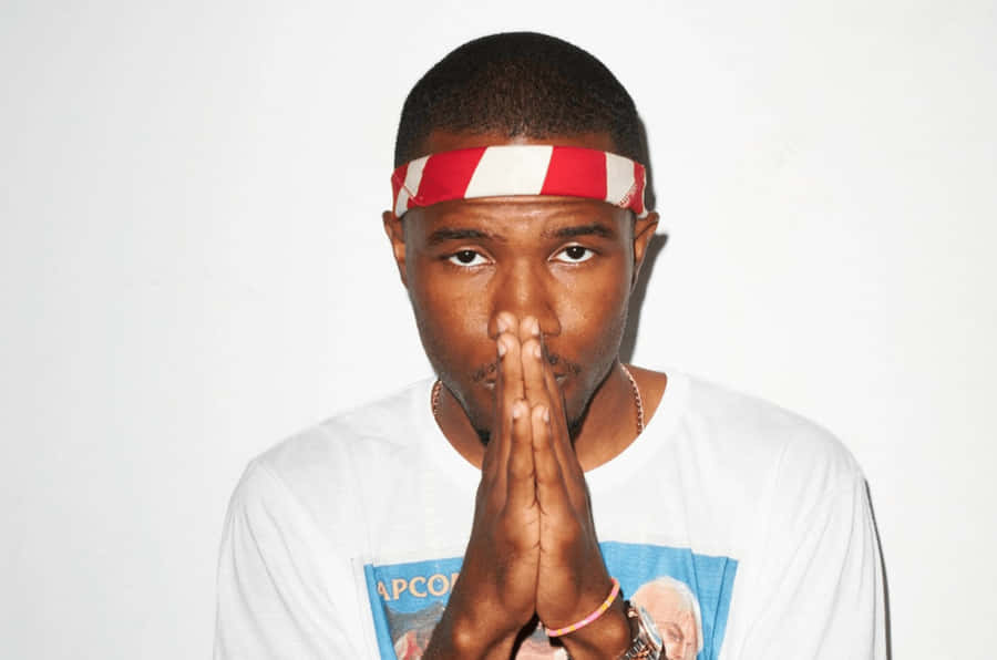 A Closeup Of Artist Frank Ocean Working On His Laptop Wallpaper