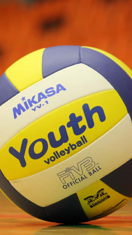 A Colorful Volleyball Ball In Mid-air Wallpaper