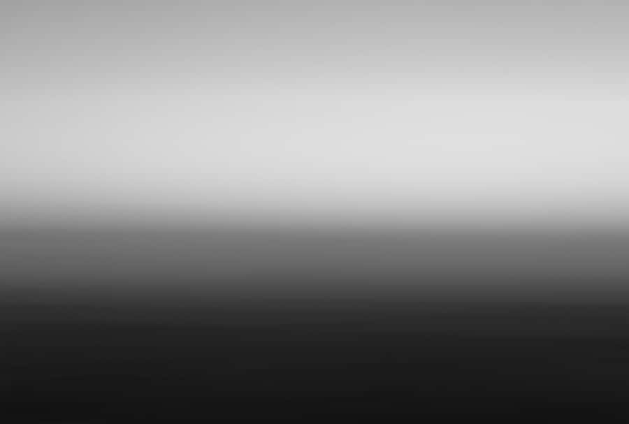 A Crisp And Striking Black Gradient Wallpaper