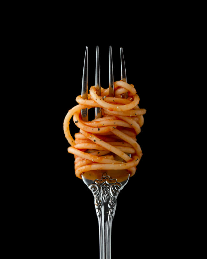 A Fork With Spaghetti On It Wallpaper