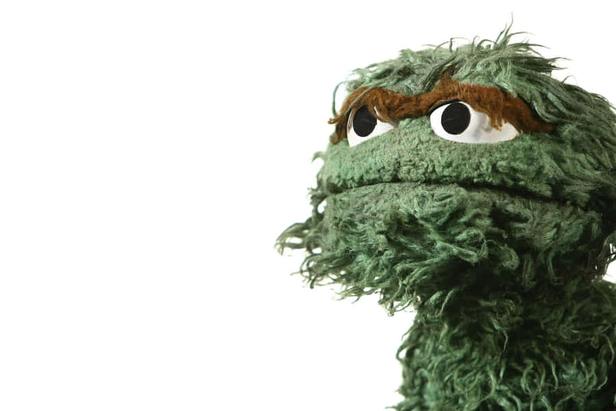 A Green Stuffed Animal With Long Hair Wallpaper