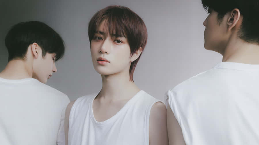 A Group Of Young Men Standing In Front Of A White Background Wallpaper