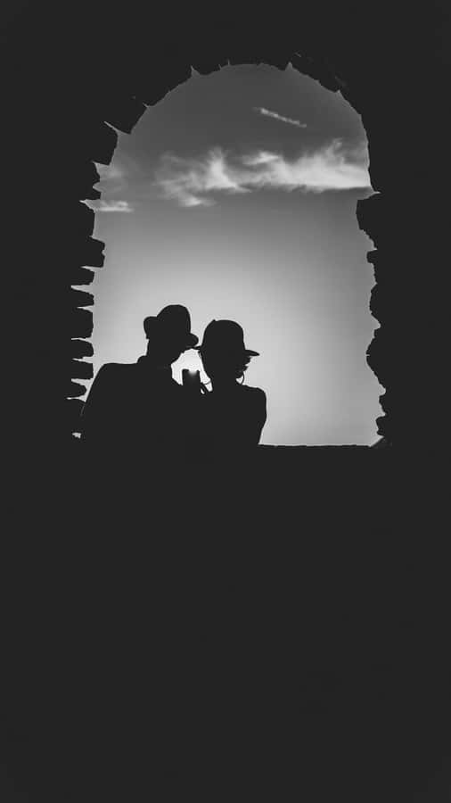 A Happy Black Couple In Love, Holding Hands, Walking In A Park.