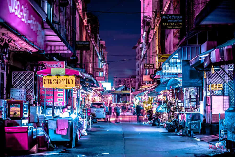 A Laptop Emitting Neon Lights For A Unique Tumblr Experience. Wallpaper