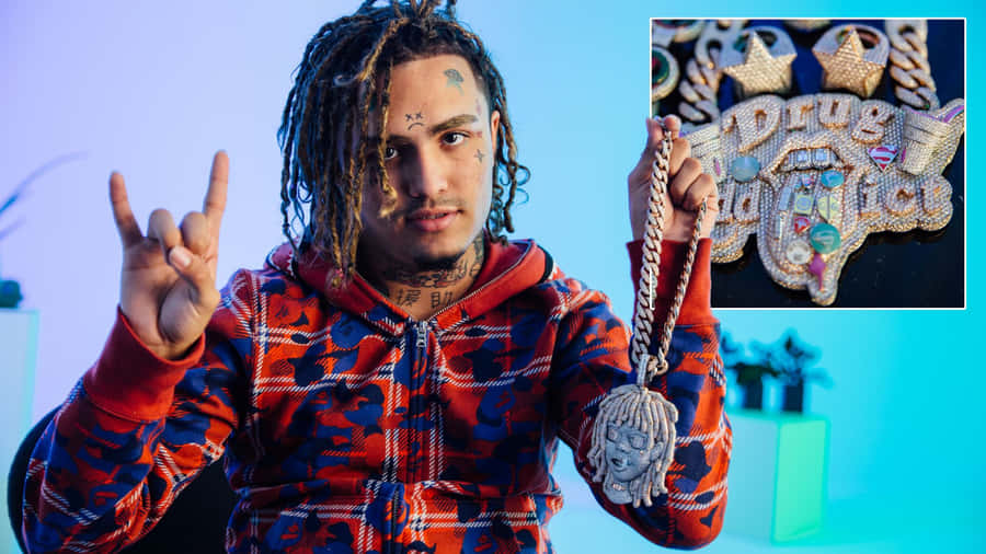 A Man Holding A Necklace With A Peace Sign Wallpaper