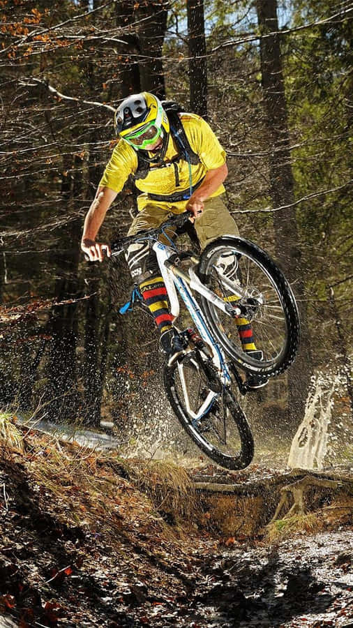A Man Riding A Mountain Bike Wallpaper