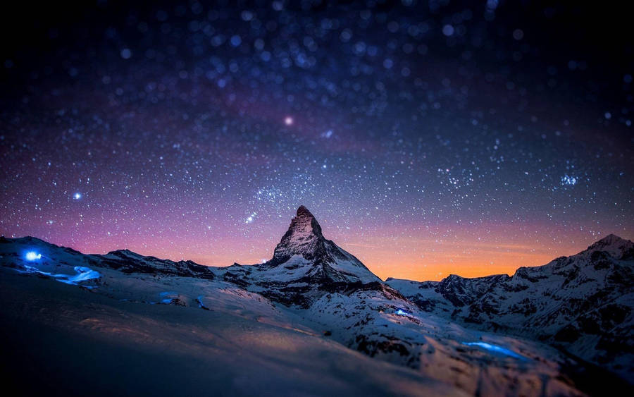 A Mystical Night Sky Spans Over Lake Wallpaper