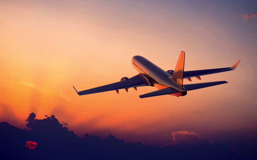 A Passenger Airplane Flying In The Sky Wallpaper