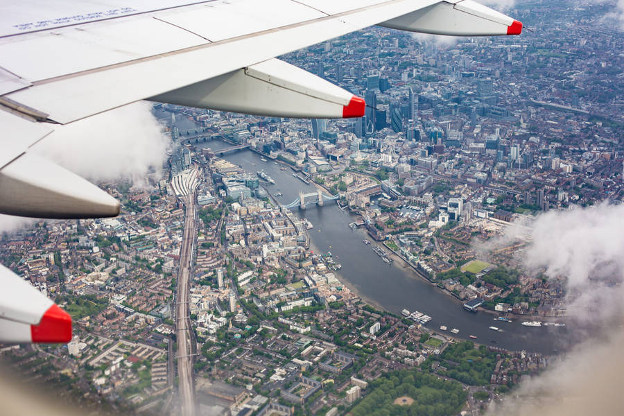 A Plane Window Sight Right After A Take Off Wallpaper