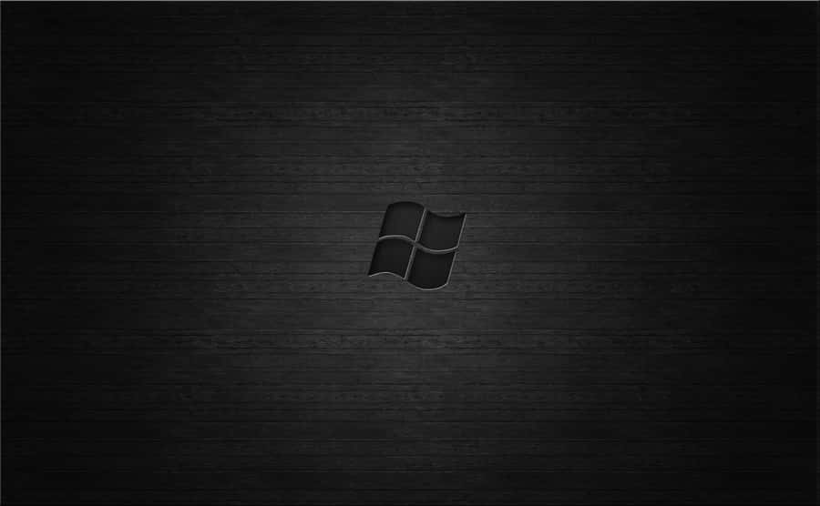 A Sleek Dark Desktop Background Set Against A Deep Brown And Black Textured Wallpaper Wallpaper