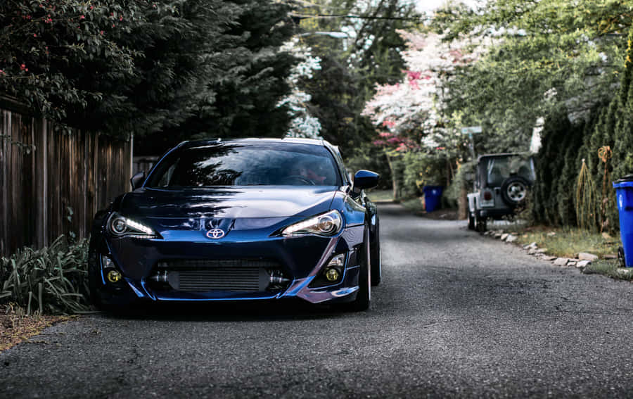 A Sleek Toyota 86 With Matte Black Finish Wallpaper